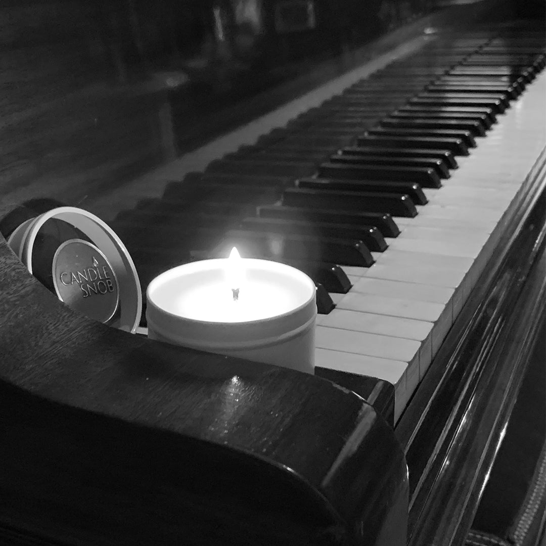 candle Snob gentlemans club travel candle on piano