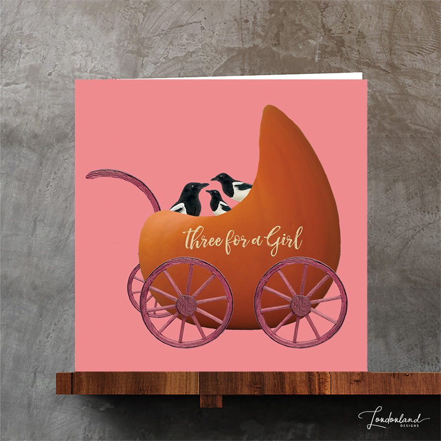 New baby girl greeting card. Three for a girl magpie in a pram made of a pumpkin.