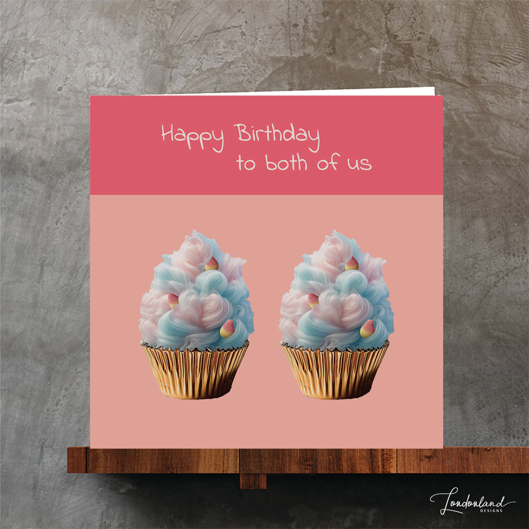 Birthday card for your twin. Two candy floss cupcakes in foil foil on bright pink background.