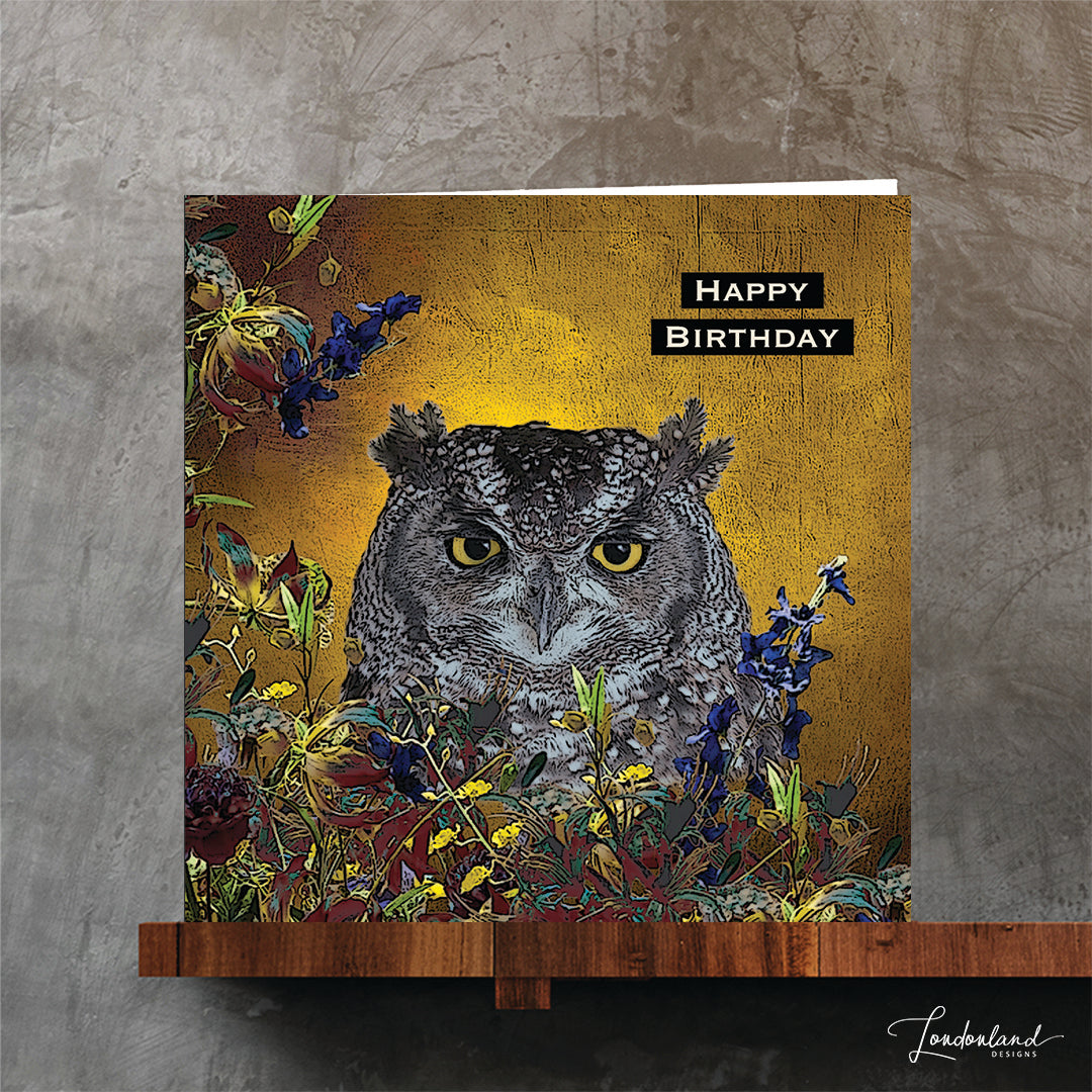 Designer birthday greeting card with an owl and floral design on a golden textured background