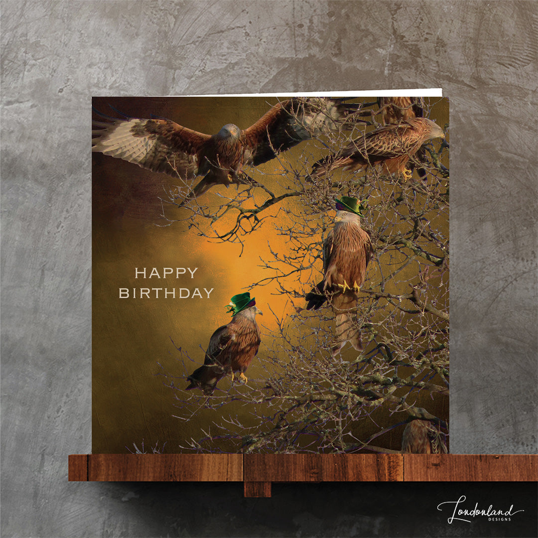 Kite birds wearing hats on tree branches, designer birthday card by Londonland Designs