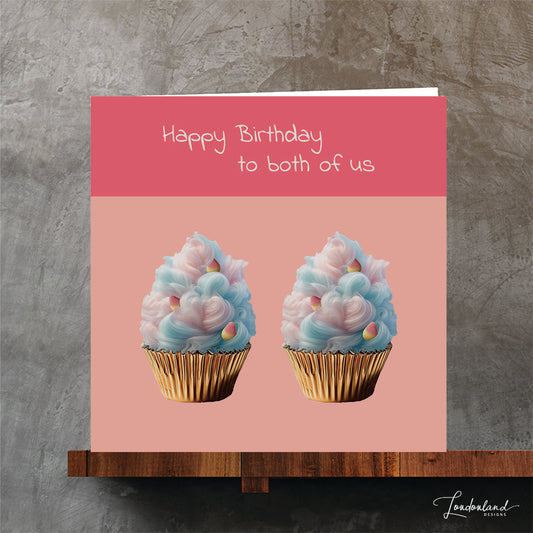 Birthday card for your twin. Two candy floss cupcakes in foil foil on bright pink background.
