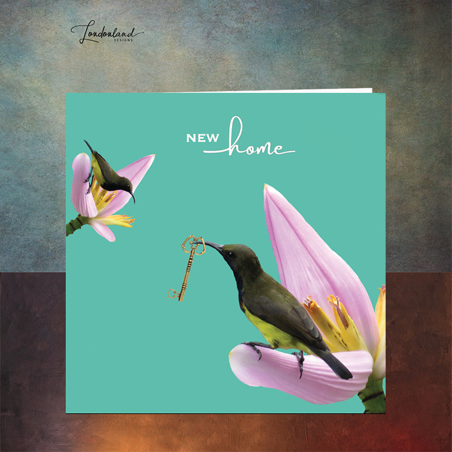 Hummingbird on a tropical flowers holding a key. Designer new home card.