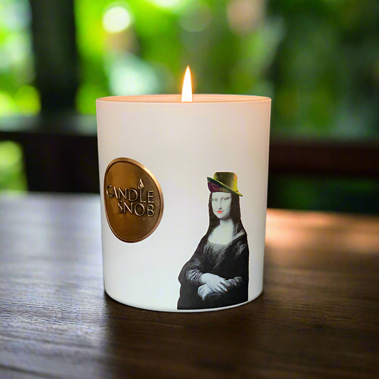 candle with Mona Lisa wearing a hat with red fingernails