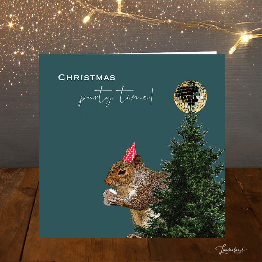 Squirrel Party Christmas Card with squirrel drinking fizz next to christmas tree